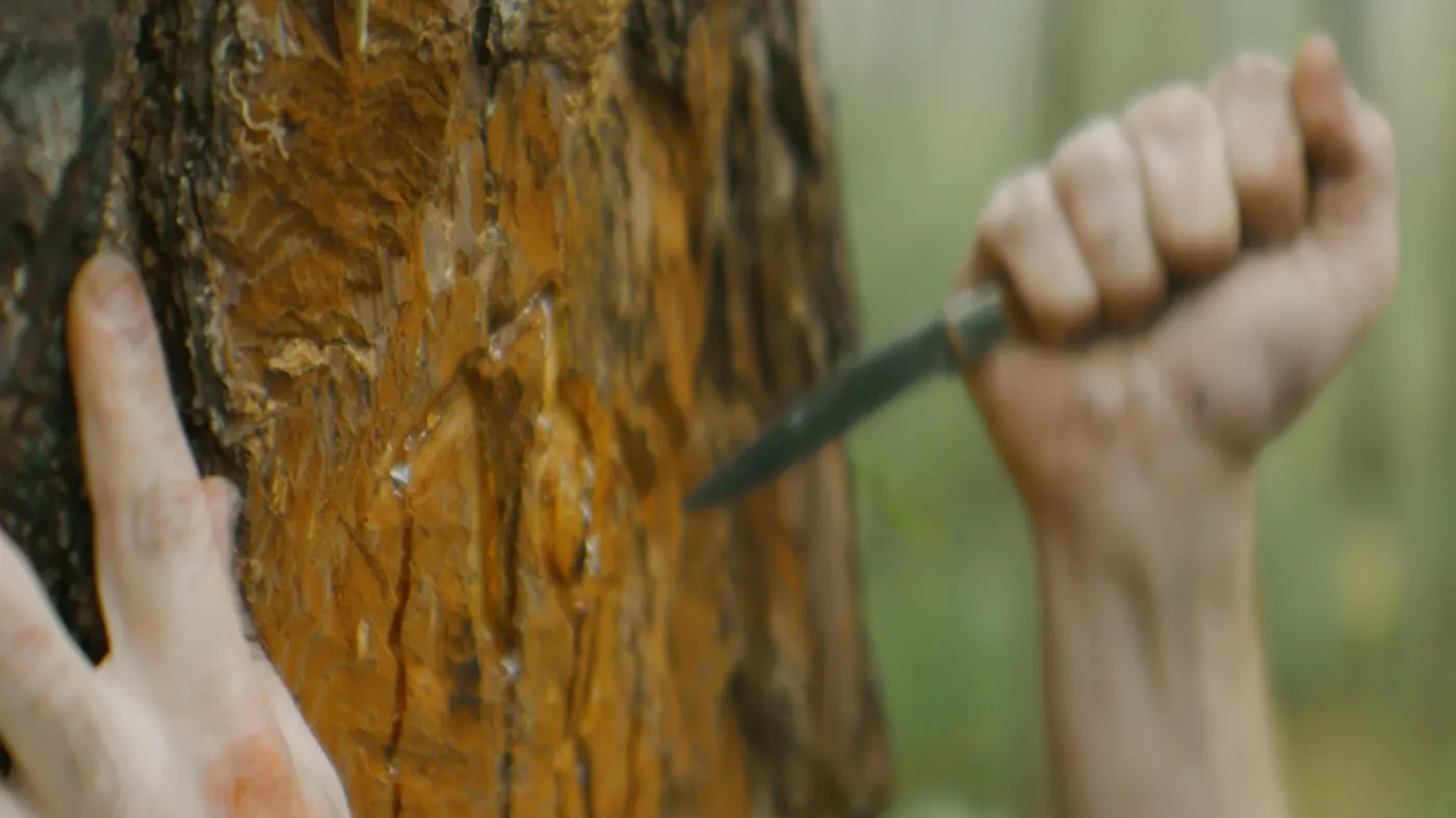 Another name is carved.